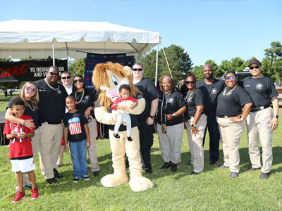 Portsmouth Sheriff's Deputies with the D.A.R.E. mascot